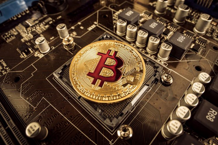 gold bit coin btc coins on the motherboard bitcoi