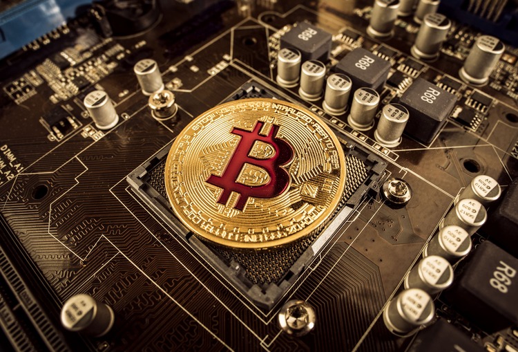 gold bit coin btc coins on the motherboard bitcoi