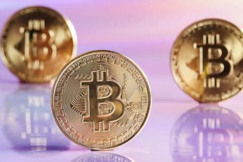 golden bitcoin coins on holographic neon backgrou utc