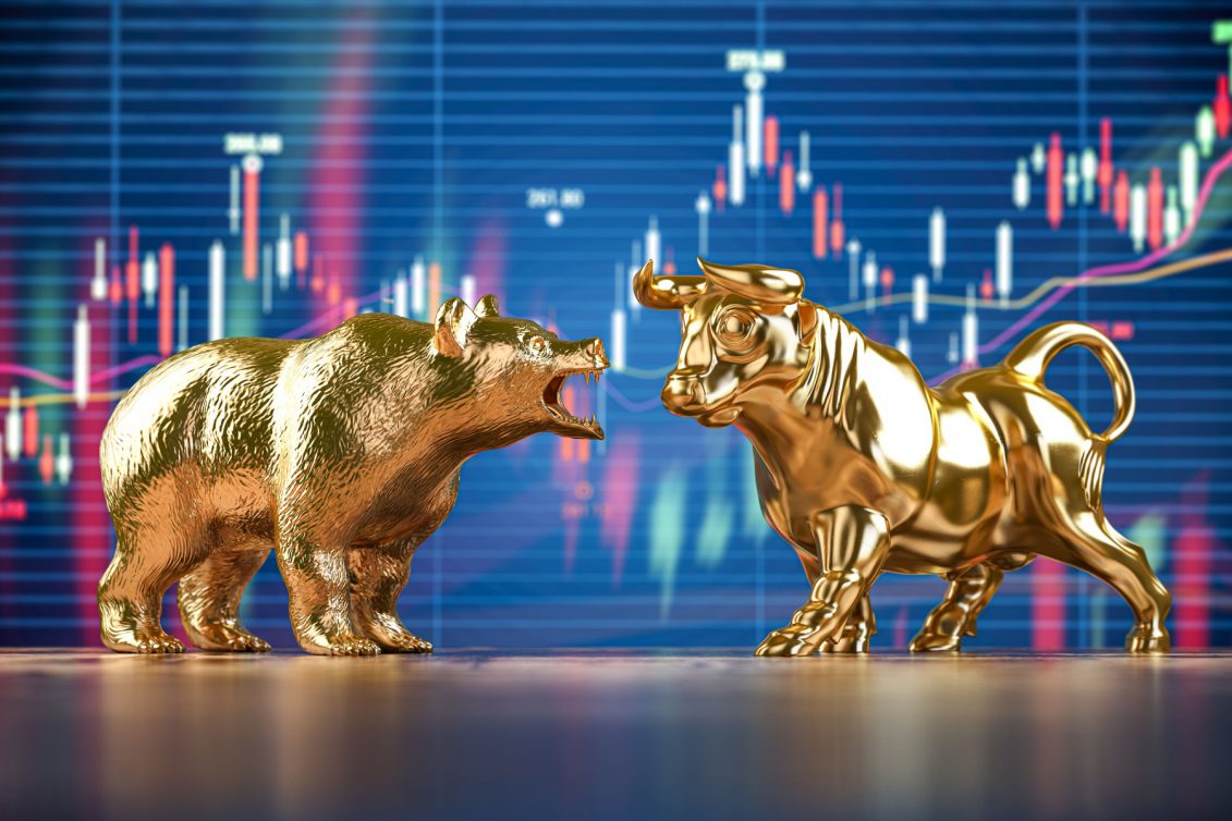 golden bull and bear on stock data chart backgroun