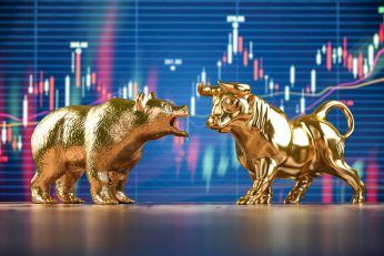 golden bull and bear on stock data chart backgroun