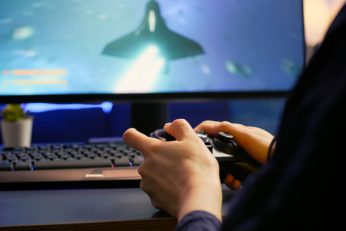 close up of professional cyber gamer playing space utc
